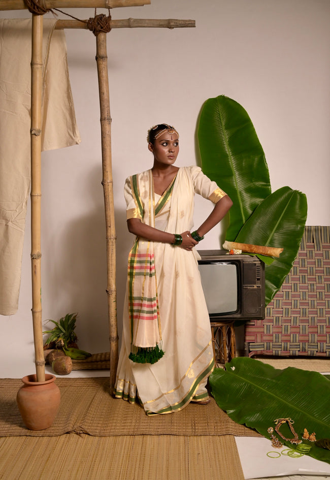 Kathakali Off white handwoven mul cotton saree with green and zari border