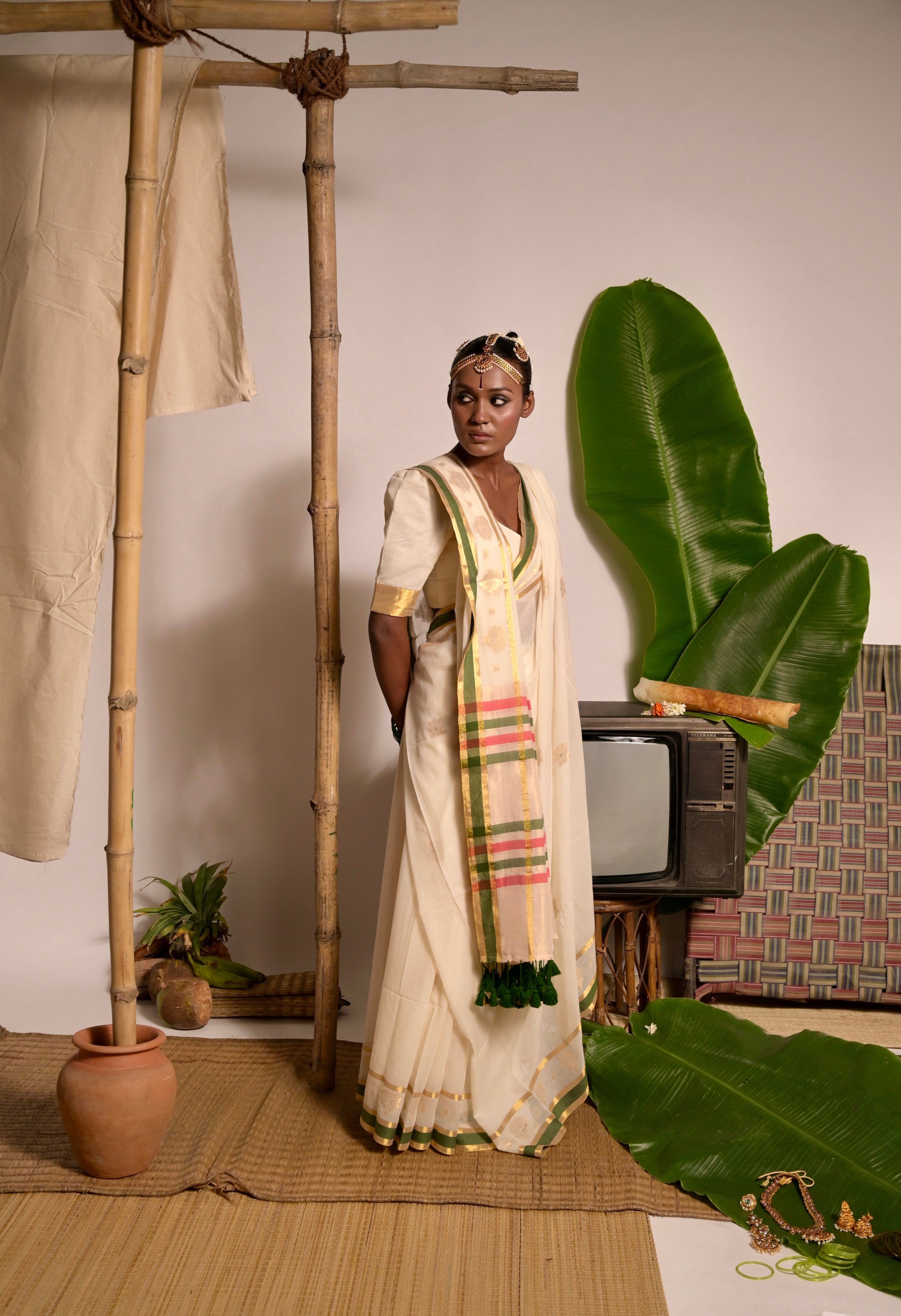 Kathakali Off white handwoven mul cotton saree with green and zari border