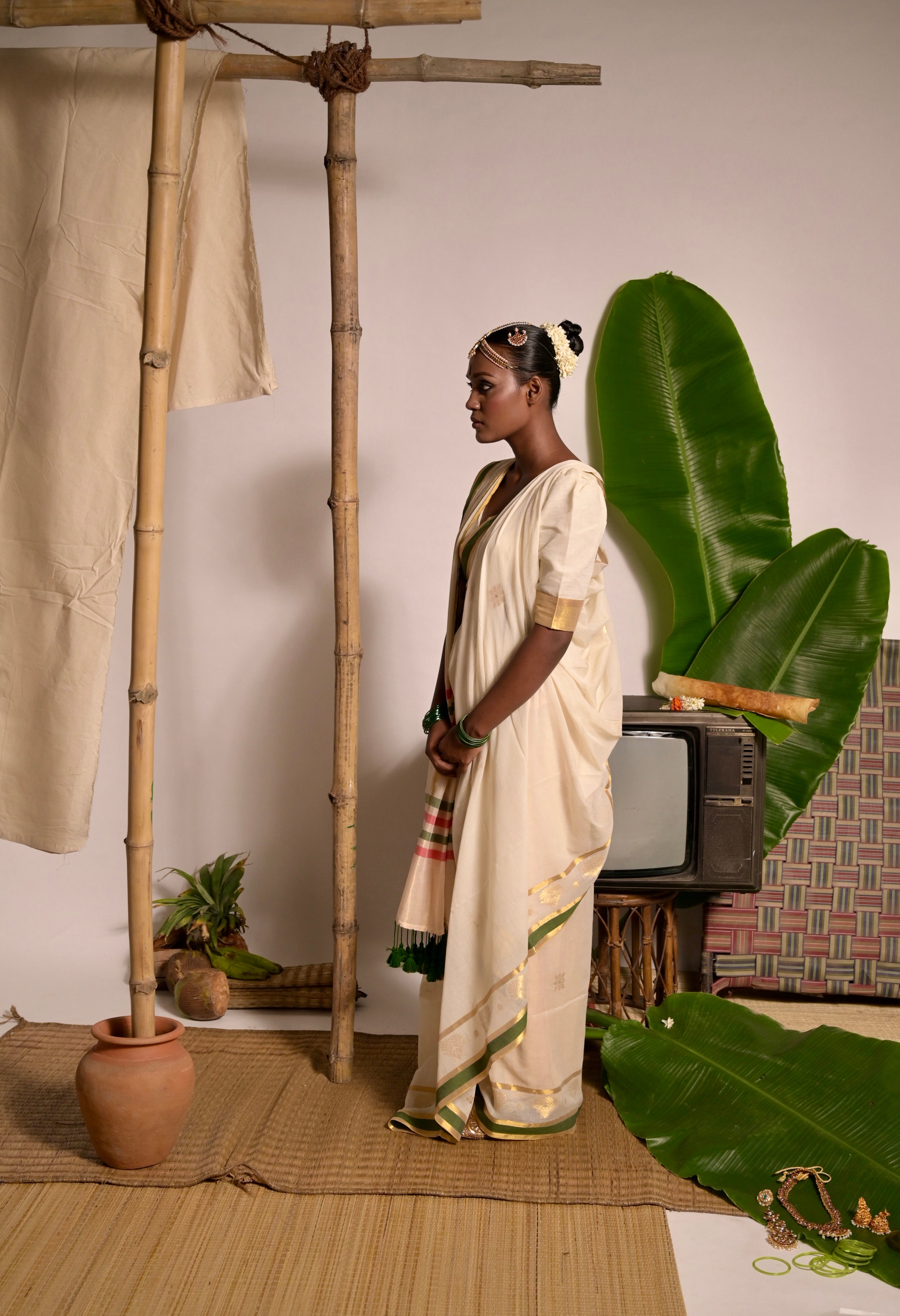 Kathakali Off white handwoven mul cotton saree with green and zari border