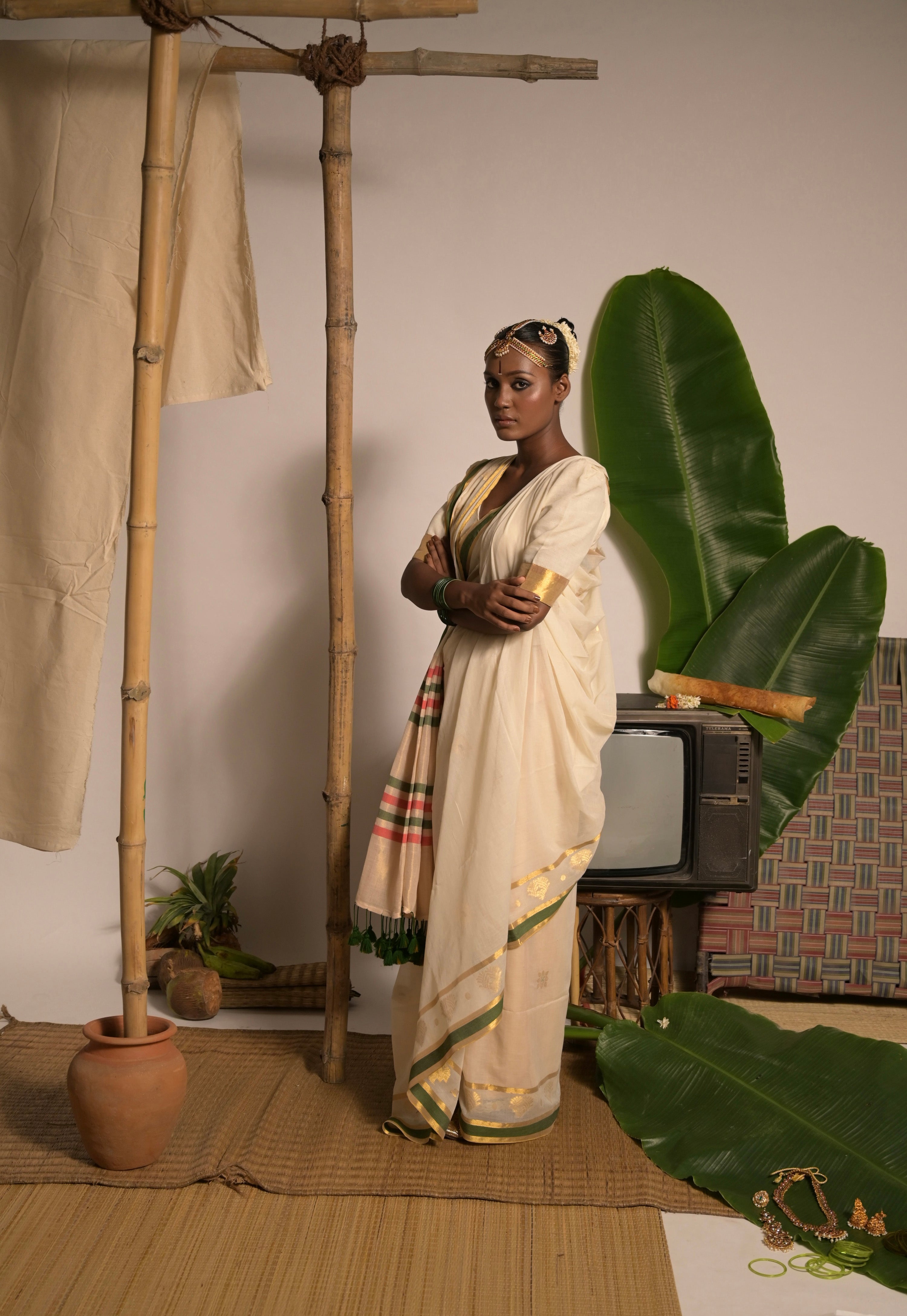 Kathakali Off white handwoven mul cotton saree with green and zari border