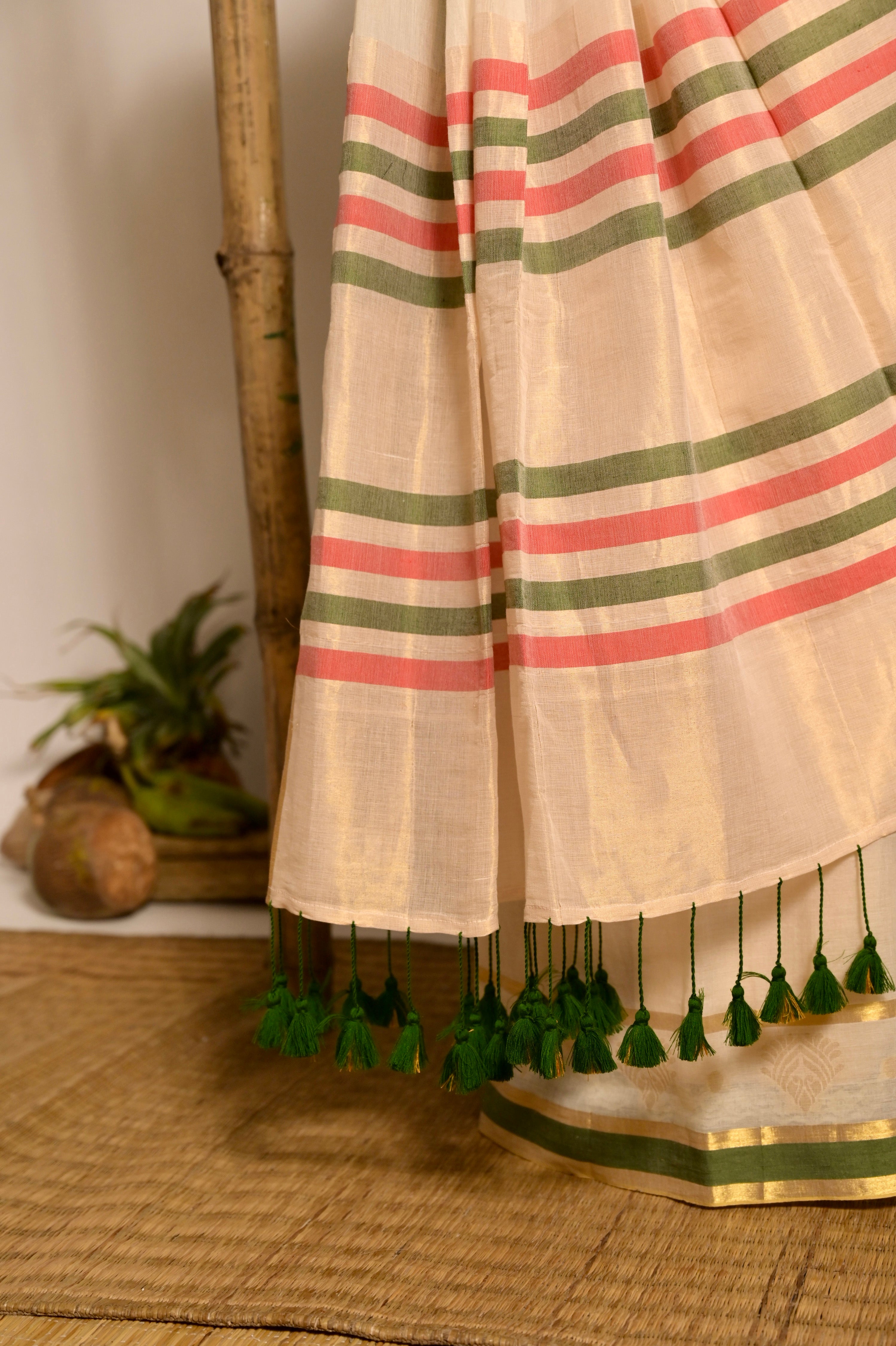 Kathakali Off white handwoven mul cotton saree with green and zari border