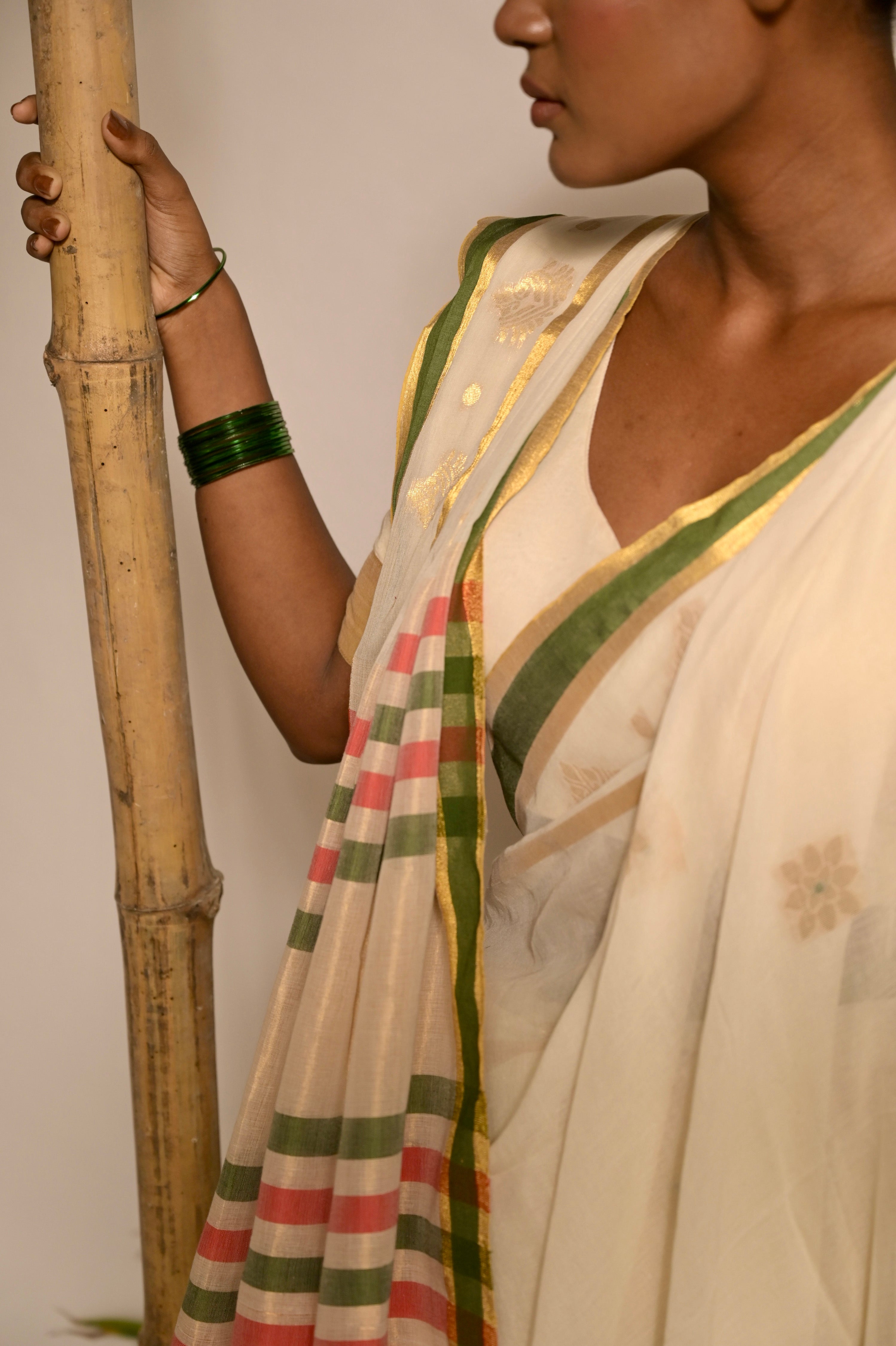 Kathakali Off white handwoven mul cotton saree with green and zari border