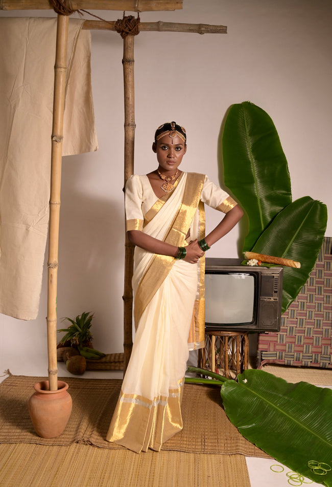 Swarnamaya Off white mul cotton handwoven saree with golden border
