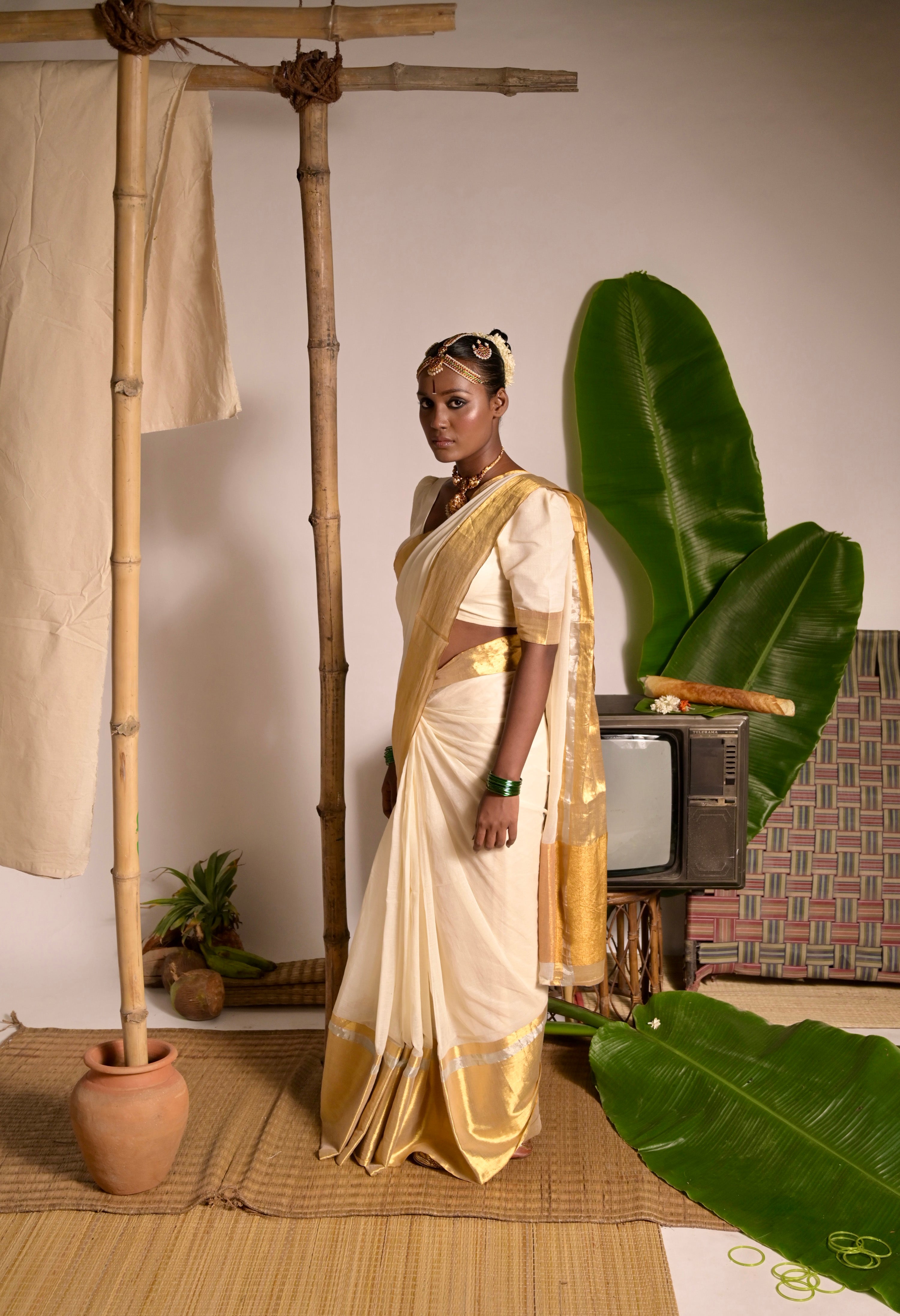 Swarnamaya Off white mul cotton handwoven saree with golden border