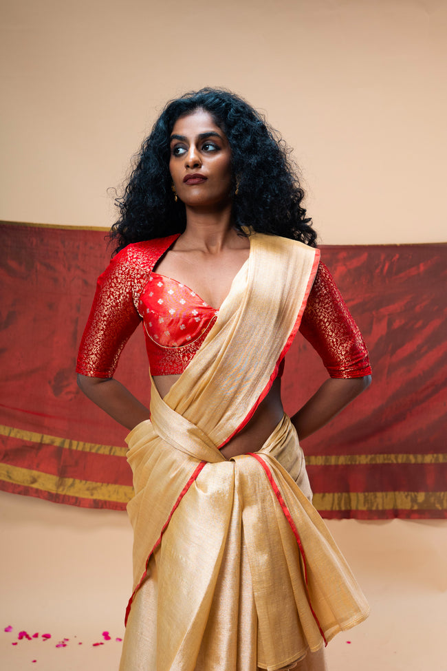 MRIGVI I Rose Gold handwoven tissue saree with red border