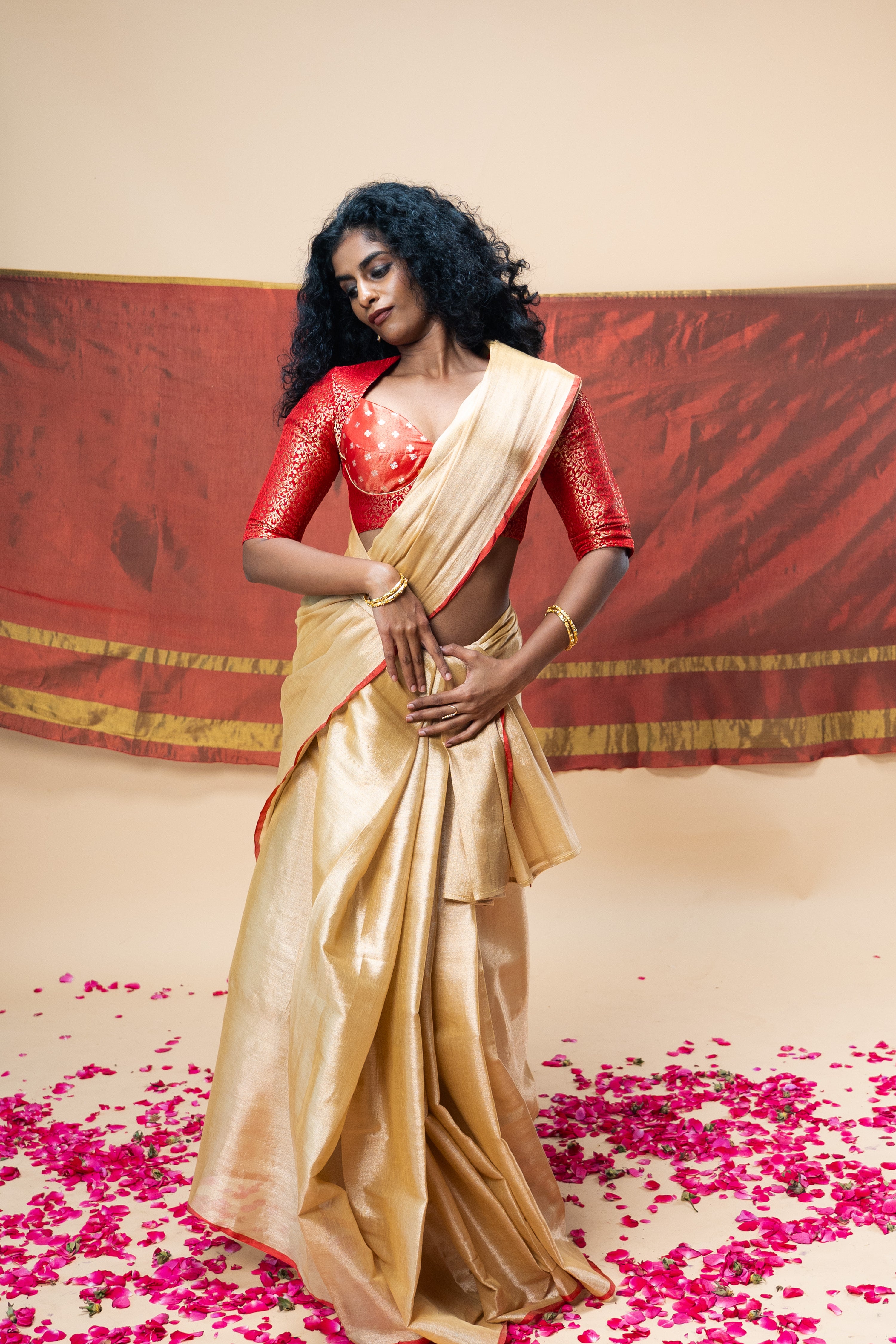 MRIGVI I Rose Gold handwoven tissue saree with red border