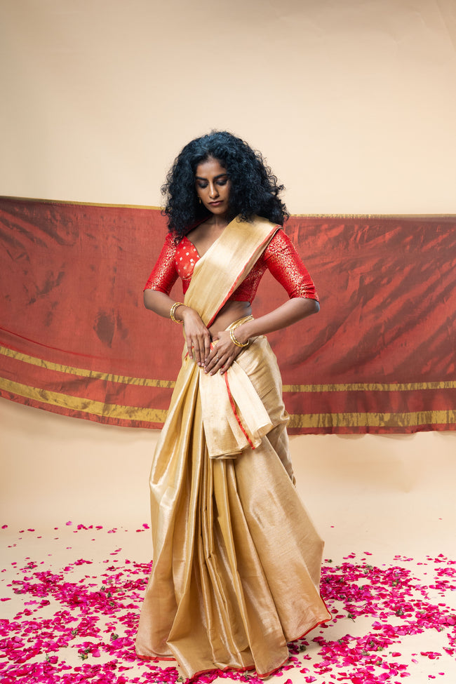 MRIGVI I Rose Gold handwoven tissue saree with red border