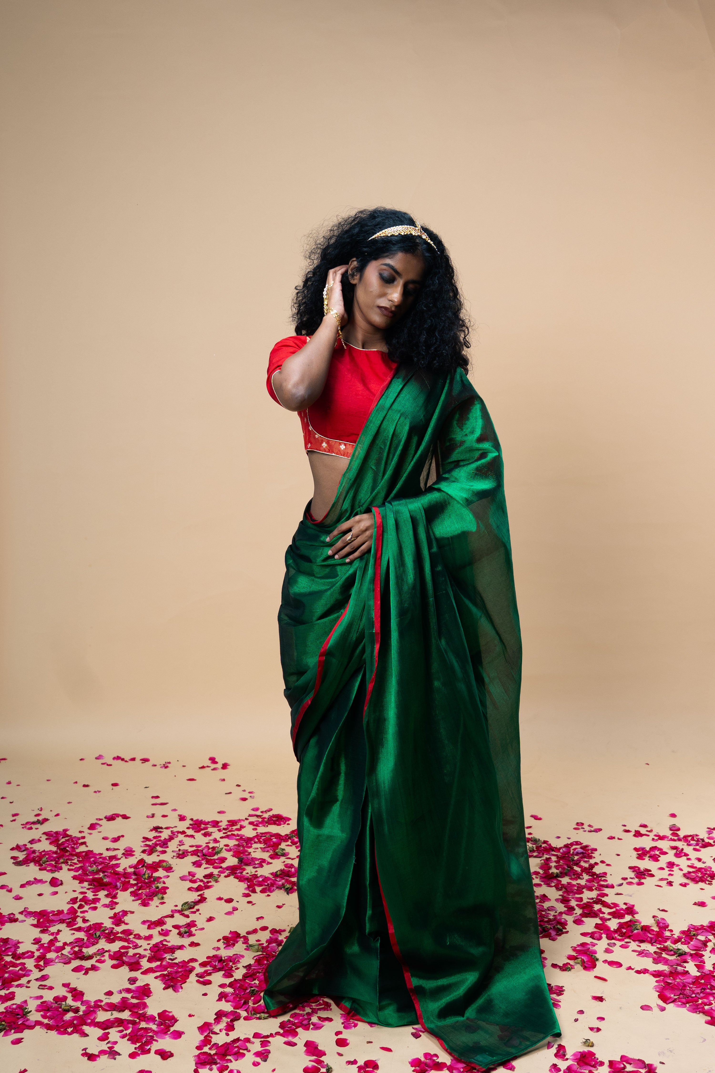 RASHVI I Green handwoven tissue saree with red border