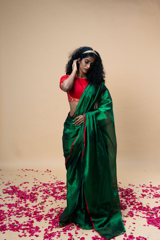 RASHVI I Green handwoven tissue saree with red border