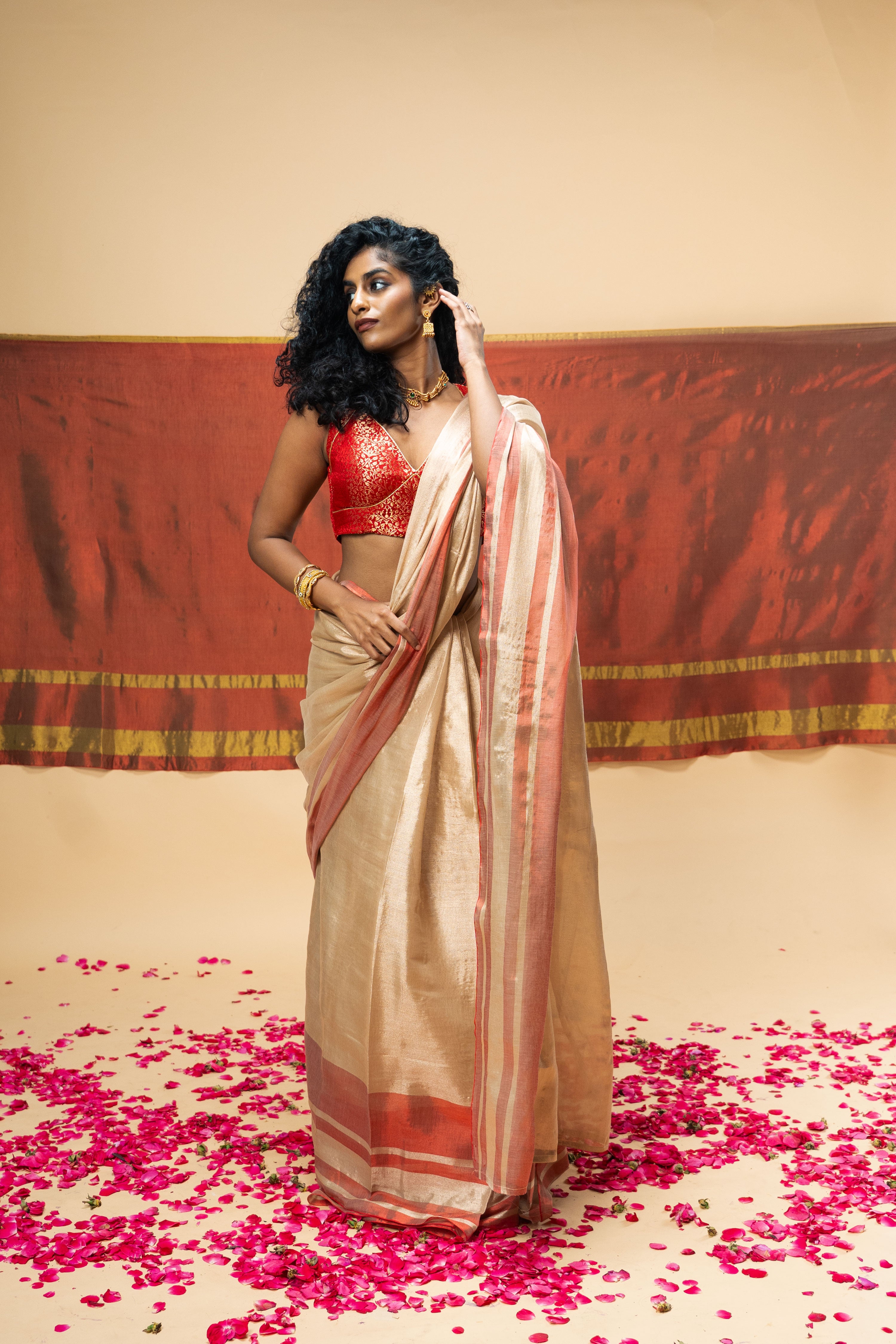 SHRAVI I Rose Gold Handwoven Tissue Saree with Red Striped Border
