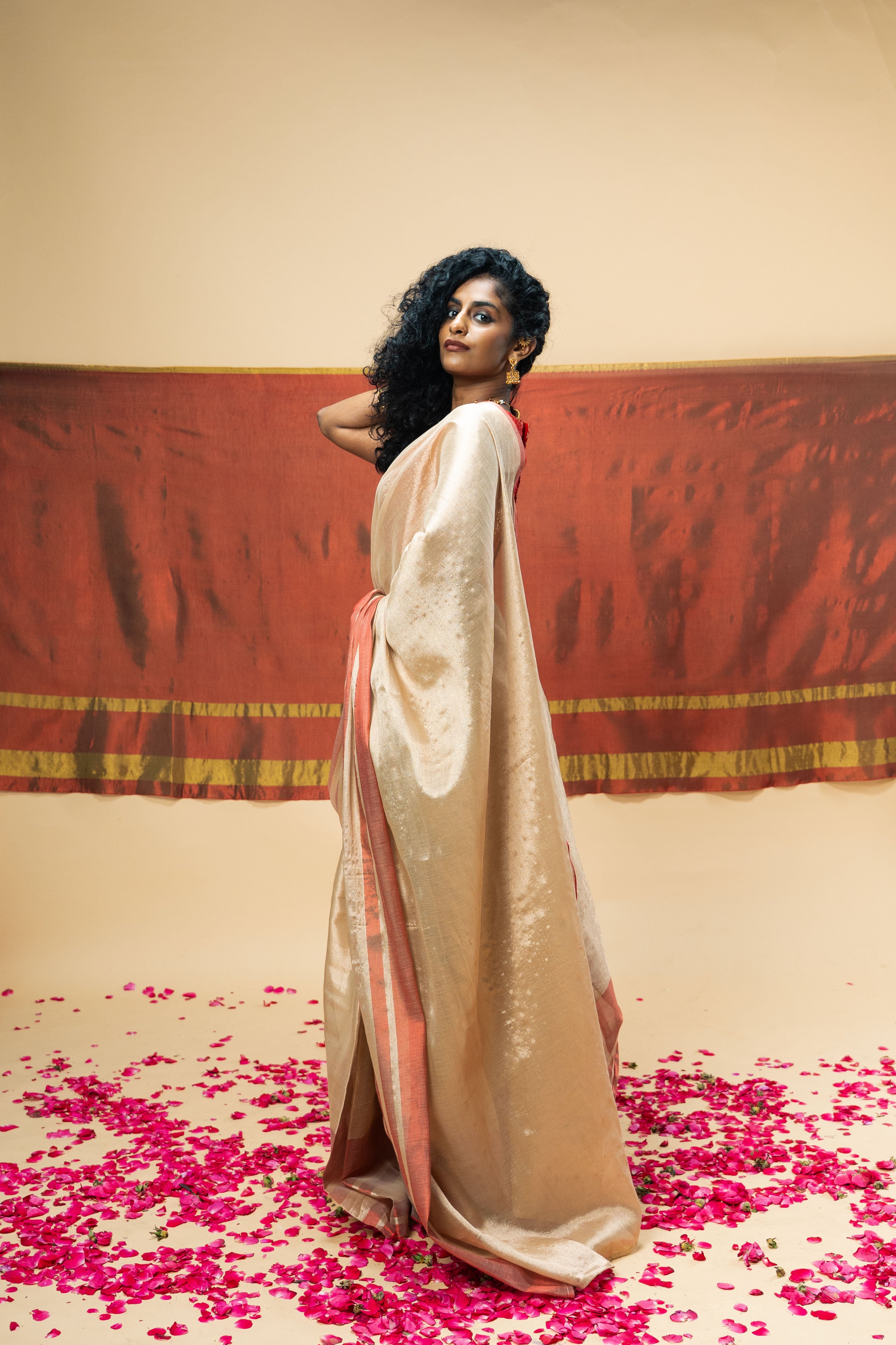 SHRAVI I Rose Gold Handwoven Tissue Saree with Red Striped Border