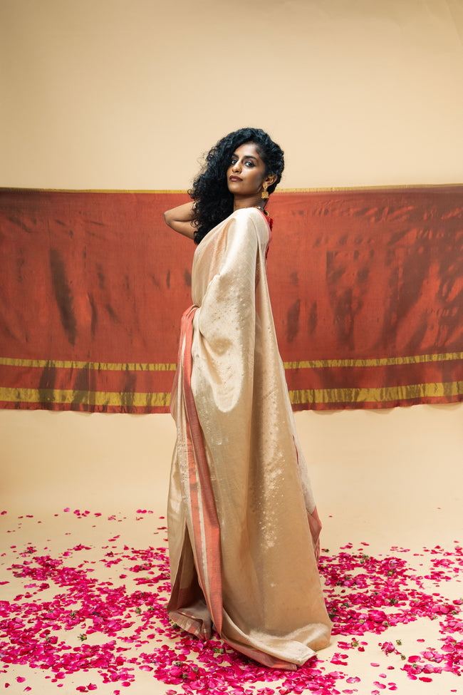 SHRAVI I Rose Gold Handwoven Tissue Saree with Red Striped Border