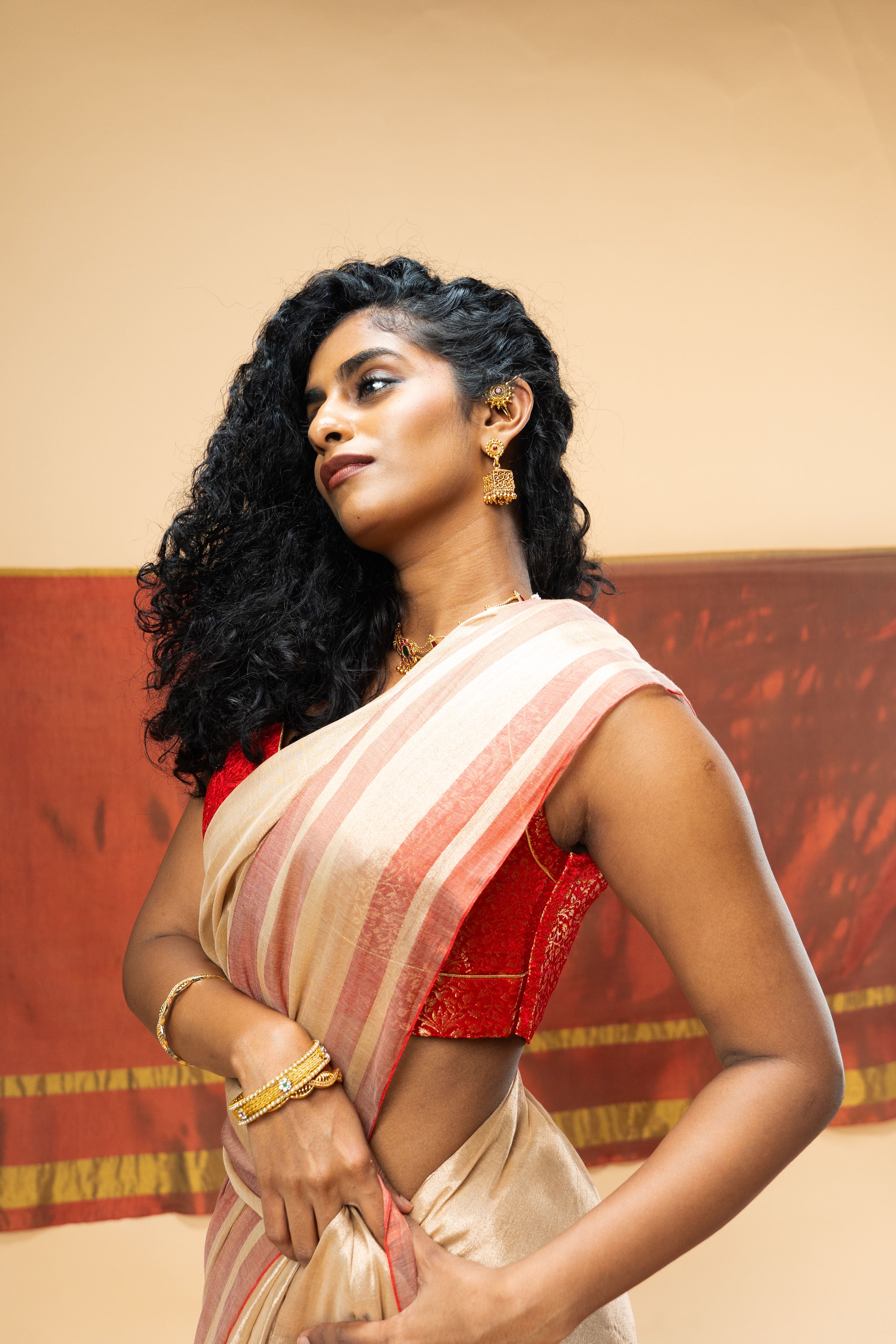 SHRAVI I Rose Gold Handwoven Tissue Saree with Red Striped Border