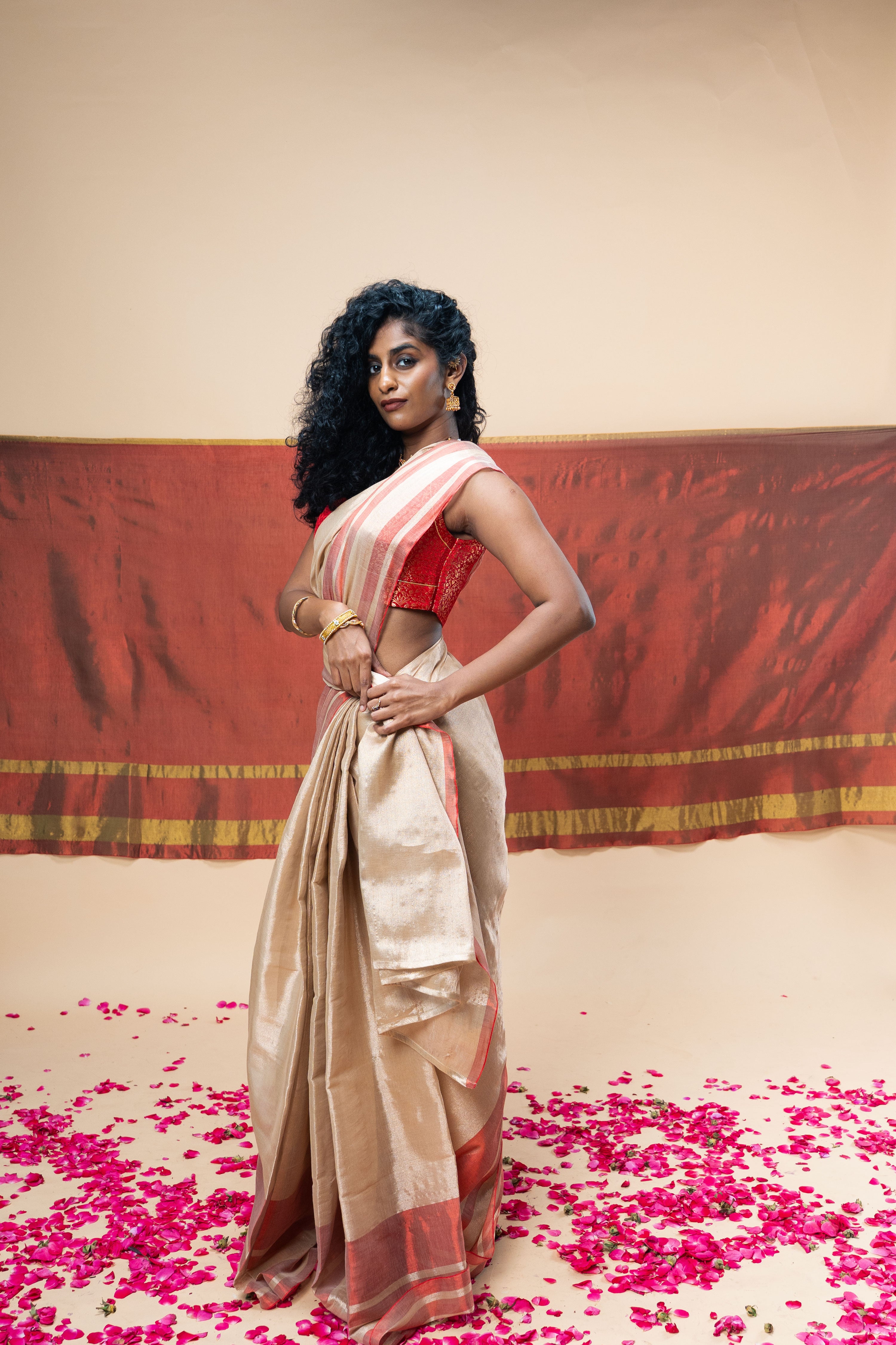 SHRAVI I Rose Gold Handwoven Tissue Saree with Red Striped Border