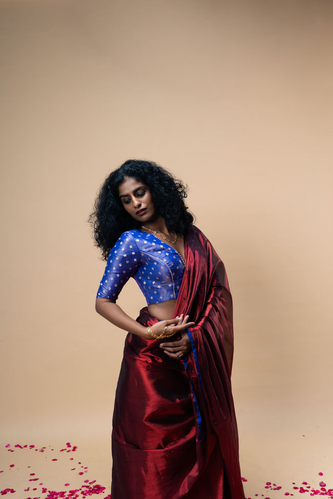 TANVYA I Red handwoven tissue saree with blue border