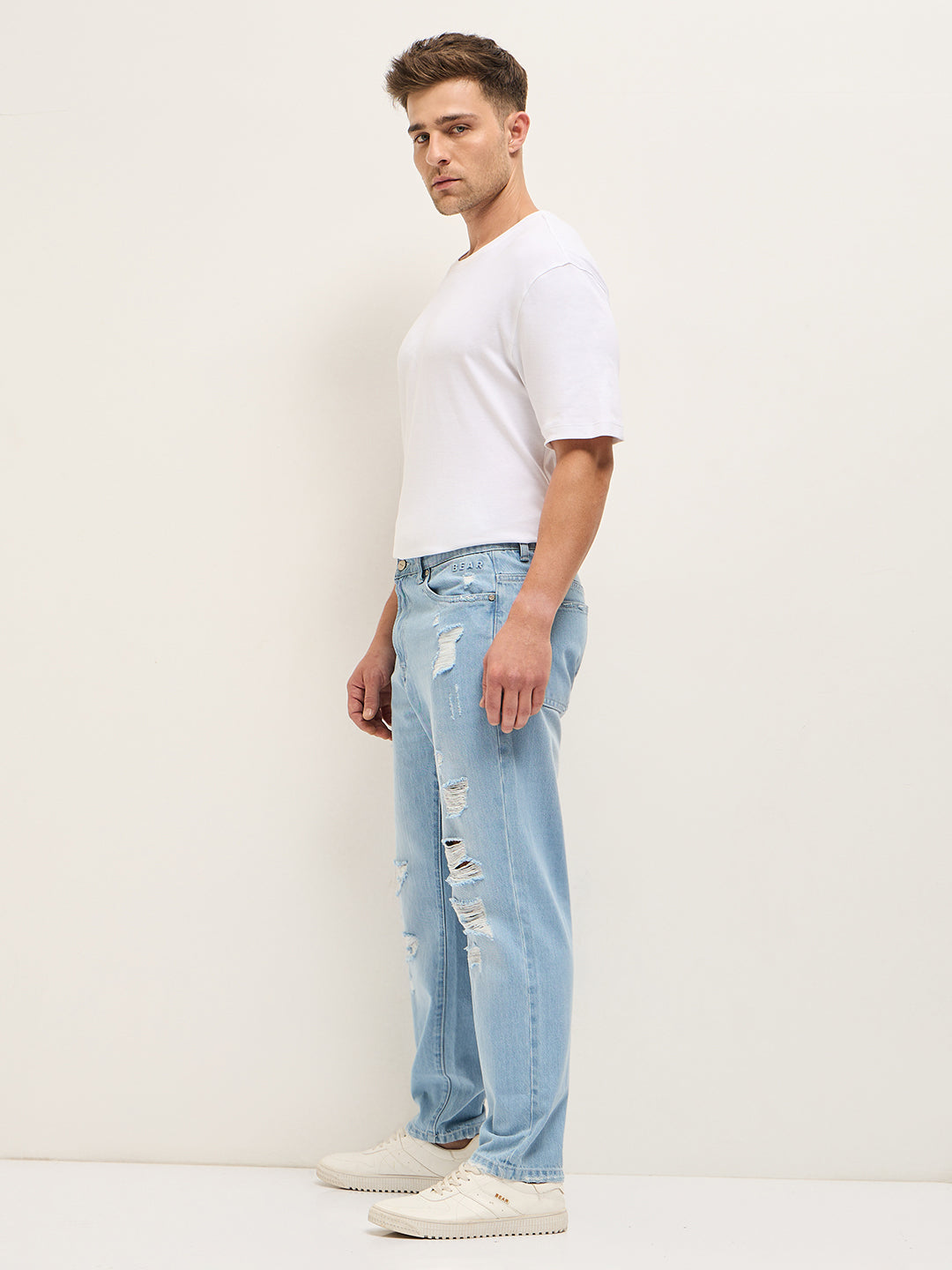 Men Light BlueLight Fade High Distressed Mid-Rise Relaxed Fit Jeans