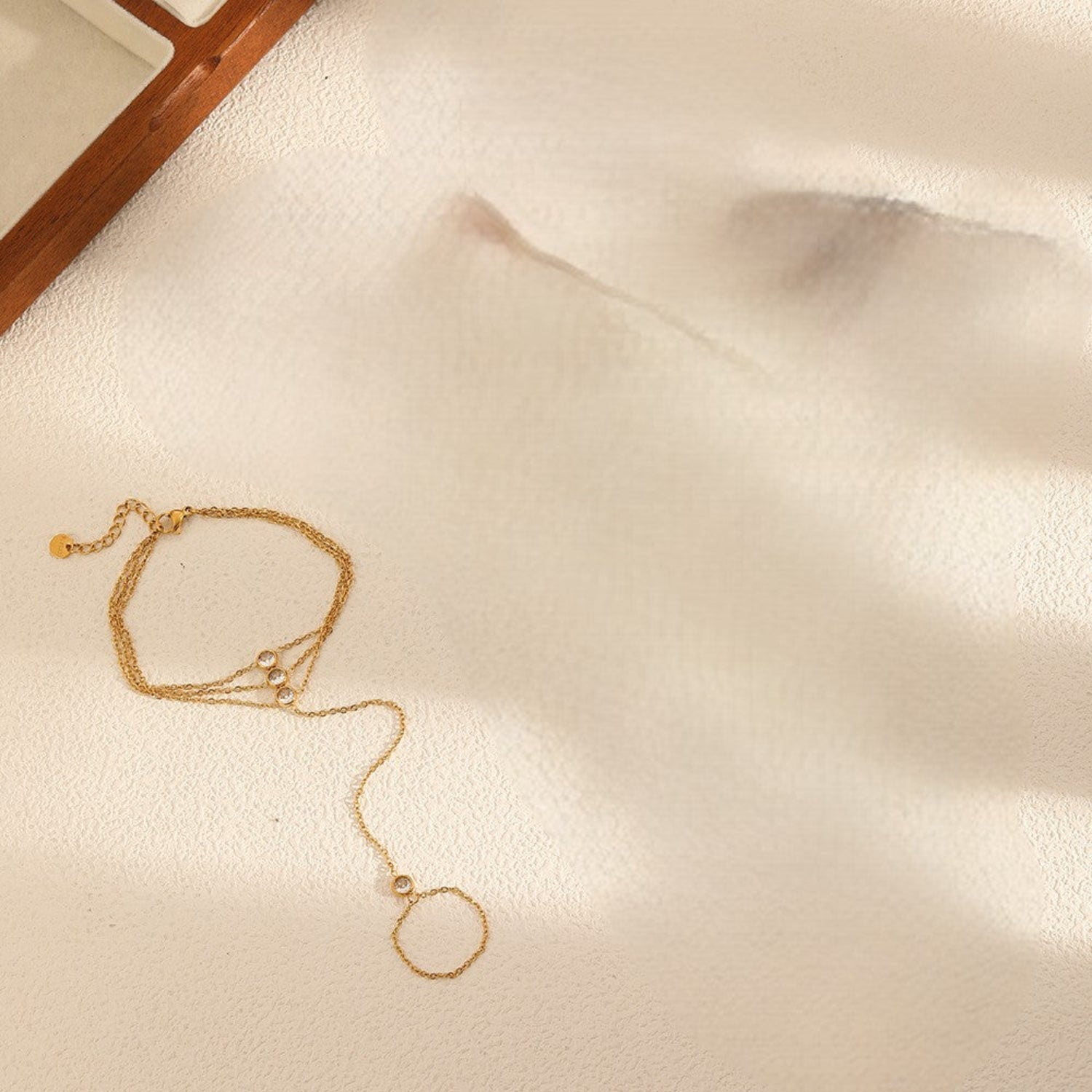 Gold Triple-Strand Crystal Hand Bracelet