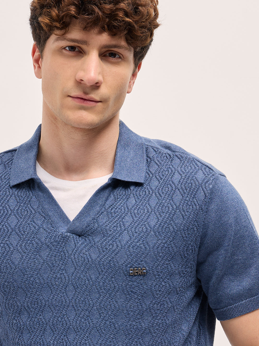 Men Blue Geometric textured Knit Slim Fit Polo