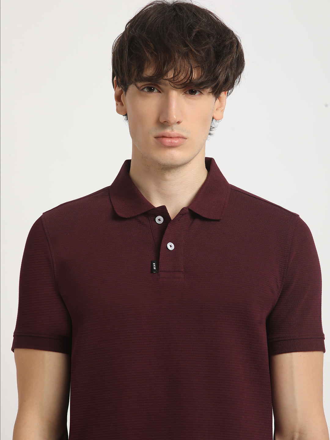 Men Maroon Self Design Regular Fit Polo Collar Tshirt