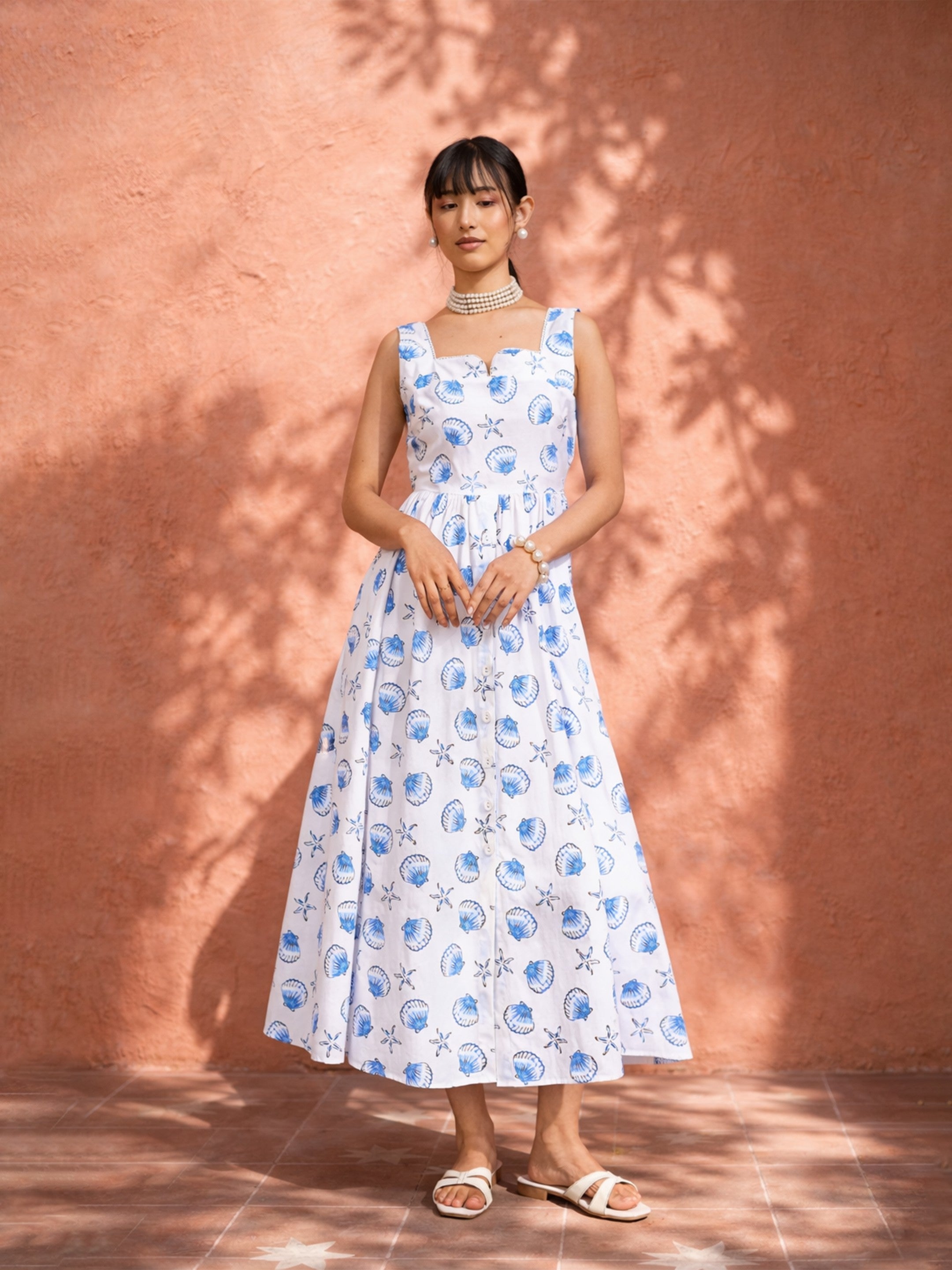 Women White & Blue Printed Sleeveless Button Down Midi Dress