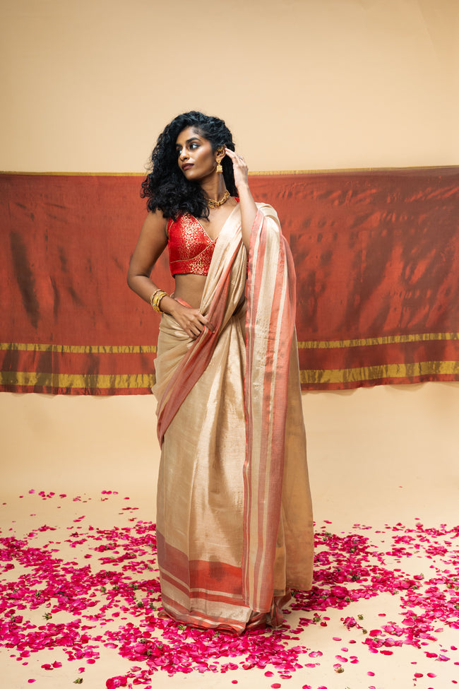 SHRAVI I Rose Gold Handwoven Tissue Saree with Red Striped Border
