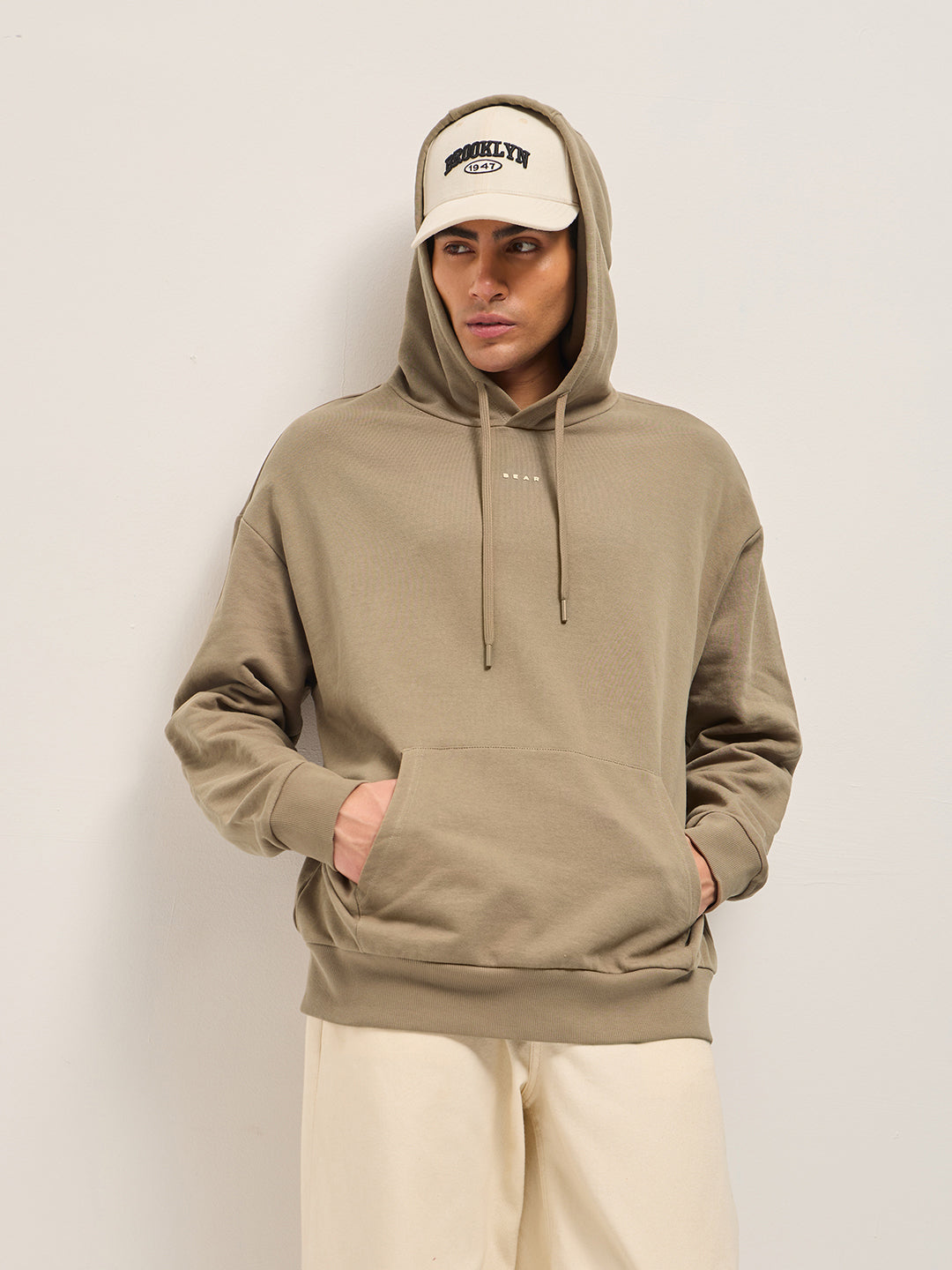 Men Beige Solid Relax Fit Hoodie