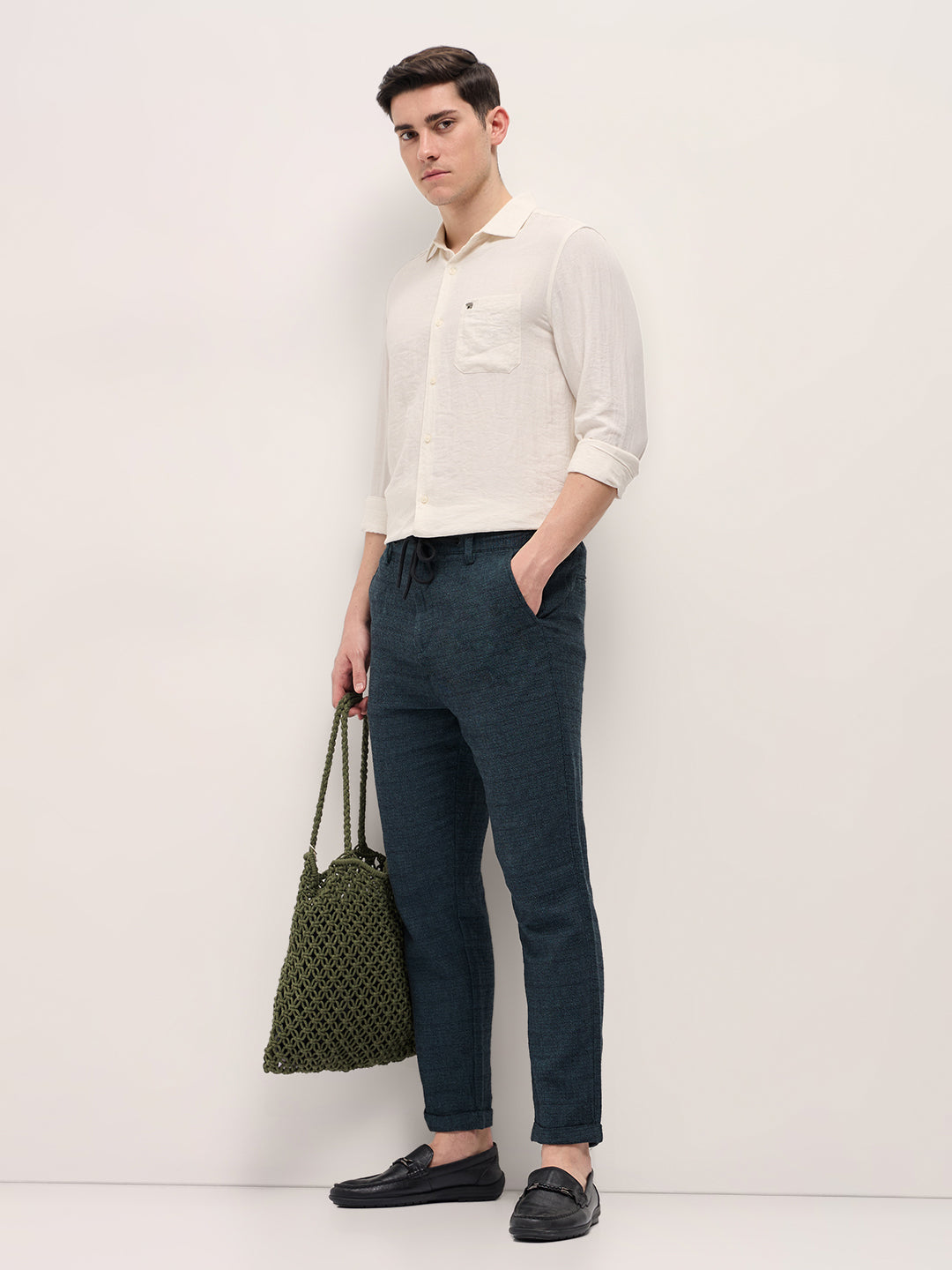 Men Teal Self Design Tapered Fit Elasticated Waist Casual Trouser