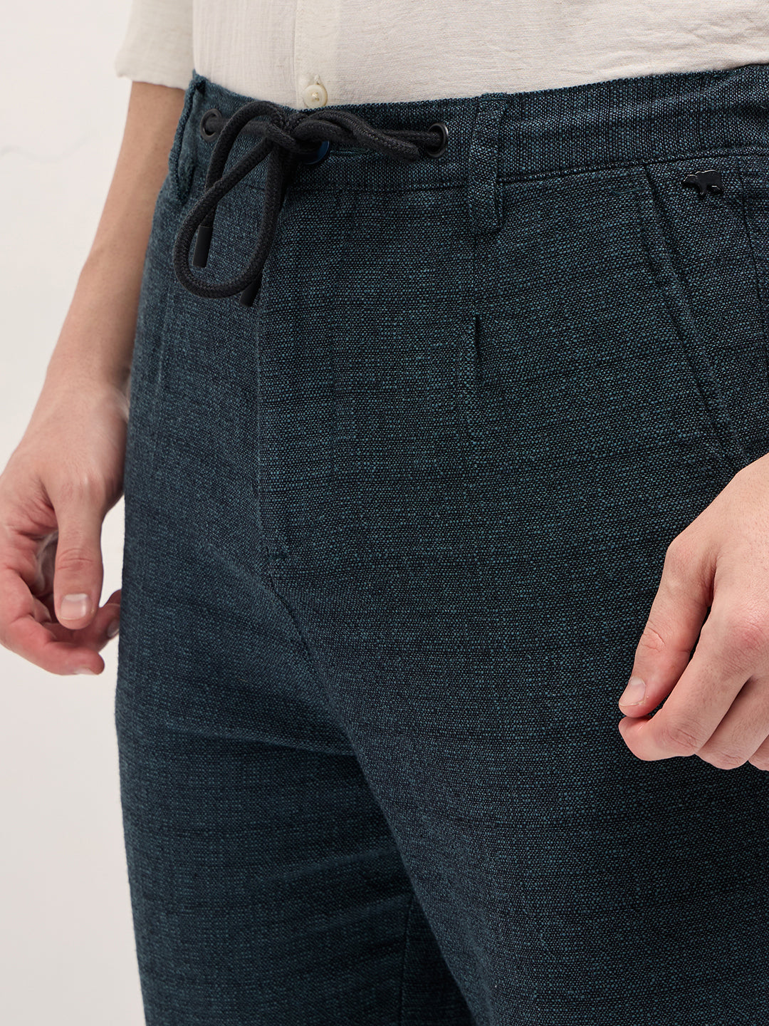 Men Teal Self Design Tapered Fit Elasticated Waist Casual Trouser