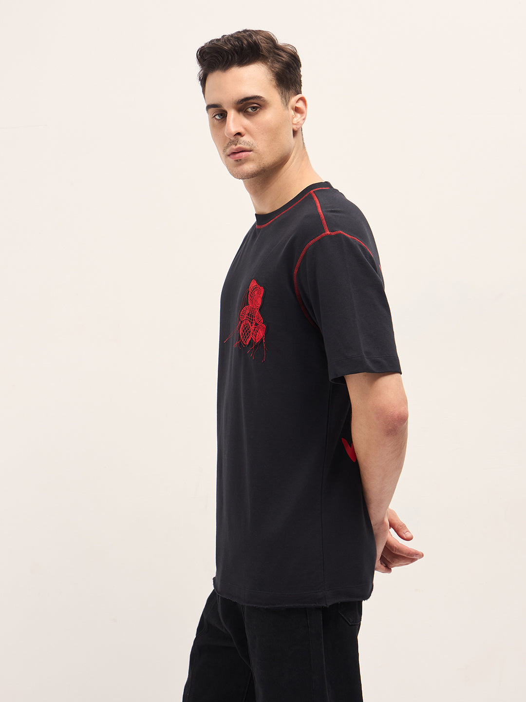Men Black Graphic T-shirt Features a Bold Statement Back Design