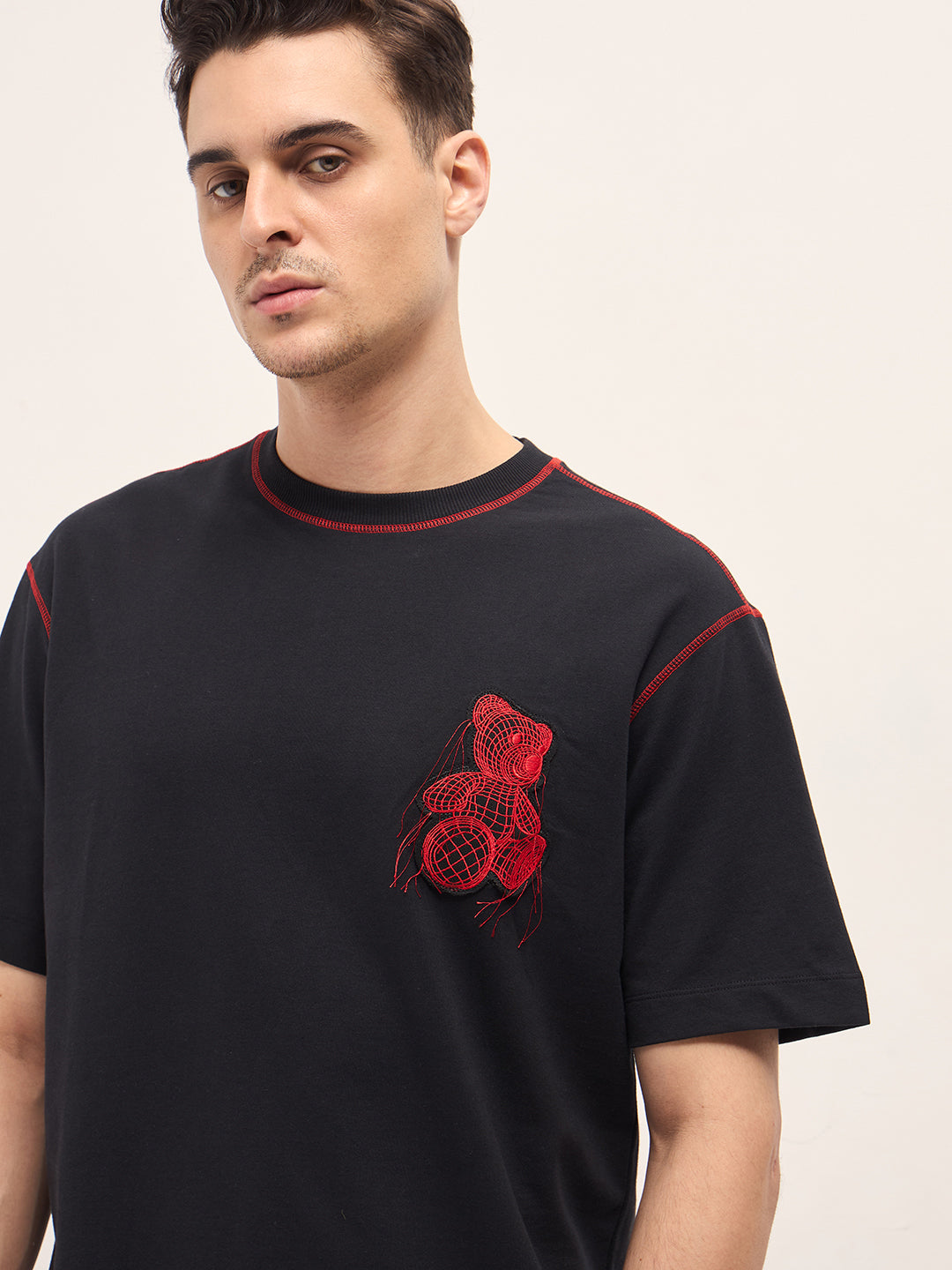Men Black Graphic T-shirt Features a Bold Statement Back Design